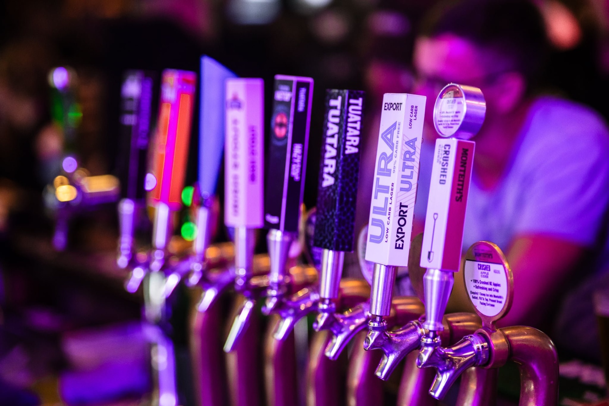 Close-up of the beer tap lineup on the bar at The Locker Room
