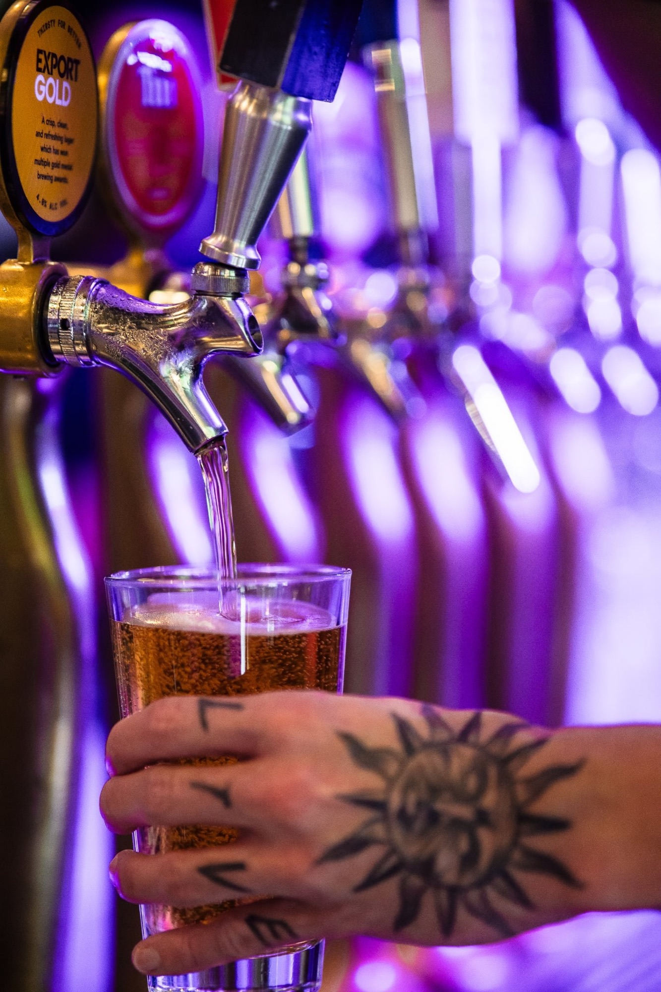 Beer being poured from the Export Gold tap at The Locker Room