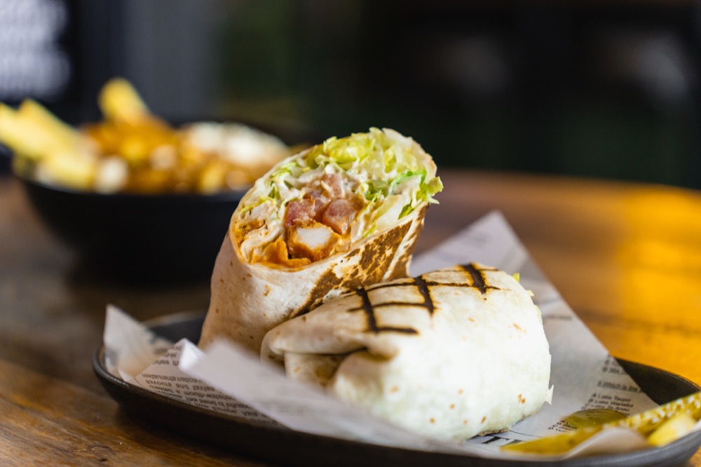 Chicken wrap and chips served at The Locker Room