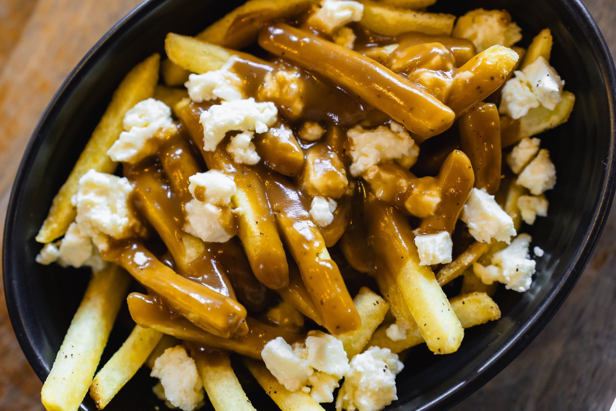 Loaded poutine-style fries with gravy and feta at The Locker Room