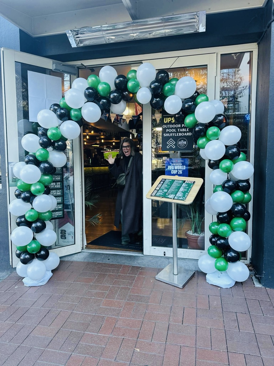Balloon arch decorating The Locker Room entrance for a birthday celebration
