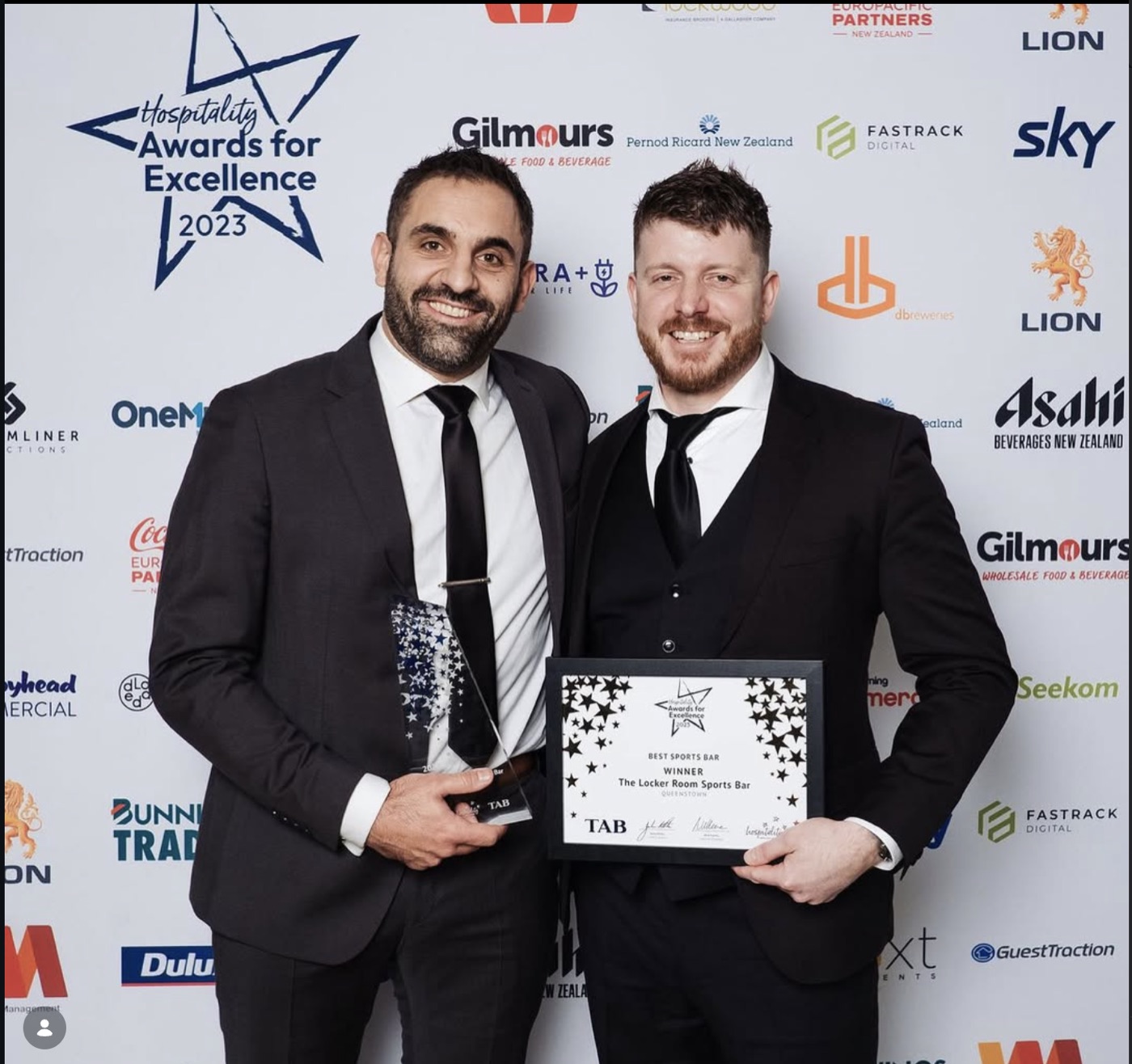Hayden and Romain accepting the Best Sports Bar award at the 2023 Hospitality Awards for Excellence