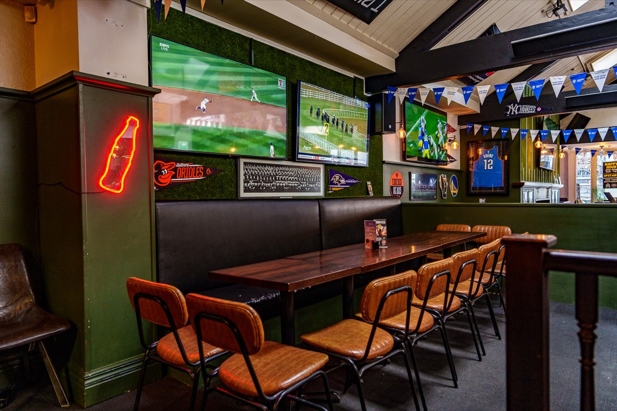 Sports memorabilia and screens at The Locker Room