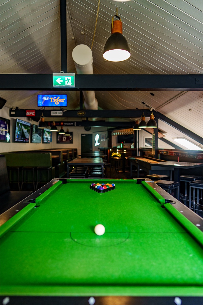 Upstairs pool table and lounge space at The Locker Room